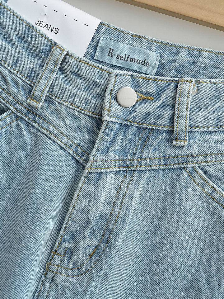 Dammjeans med hög midja, tvättad effekt och vid ben